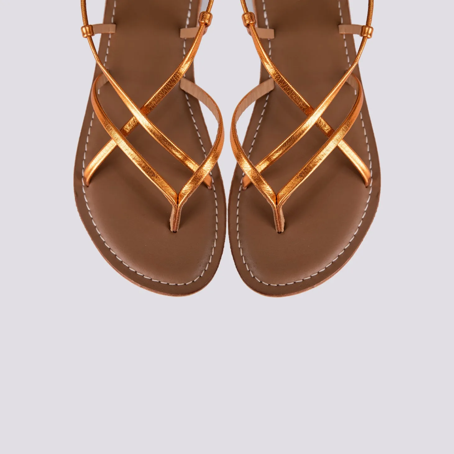Sandalo in pelle laminata arancio con lacci modello schiava
